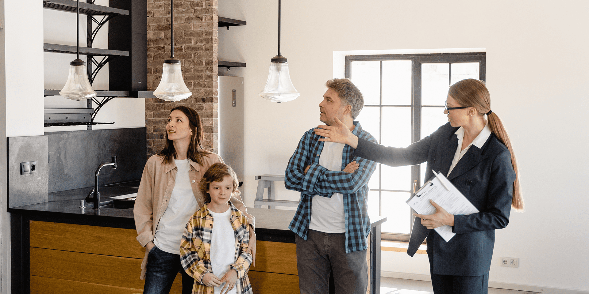 family looking at a house with realtor